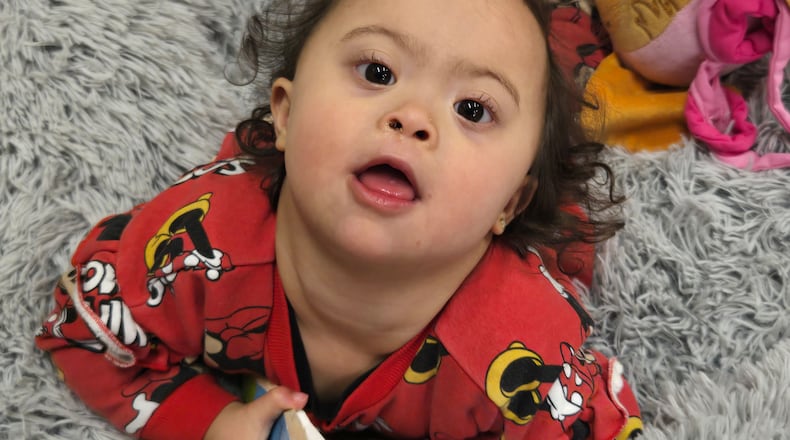 United Rehabilitation Services helps those with disabilities. Navie, age 3, was born with Down syndrome and is nonverbal. She receives physical, occupational and speech therapy at United Rehabilitation Services in Dayton. CLEARLY CREATIVE PHOTOGRAPHY/ CONTRIBUTED