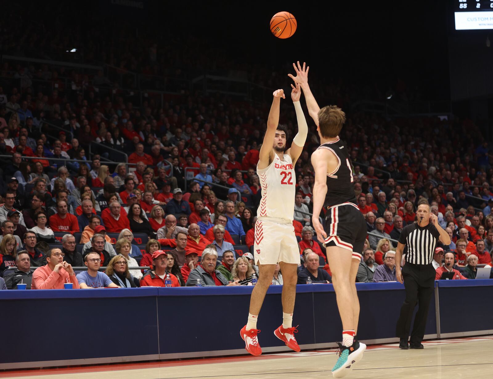 Dayton's Mustapha Amzil makes a 3-pointer against Davidson on Tuesday, Jan. 17, 2023, at UD Arena. David Jablonski/Staff
