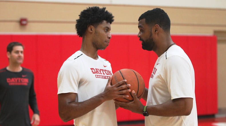 Dayton’s Jhery Matos, left, and Ricardo Greer talk during practice at the Cronin Center on Tuesday, July 31, 2018, in Dayton. David Jablonski/Staff