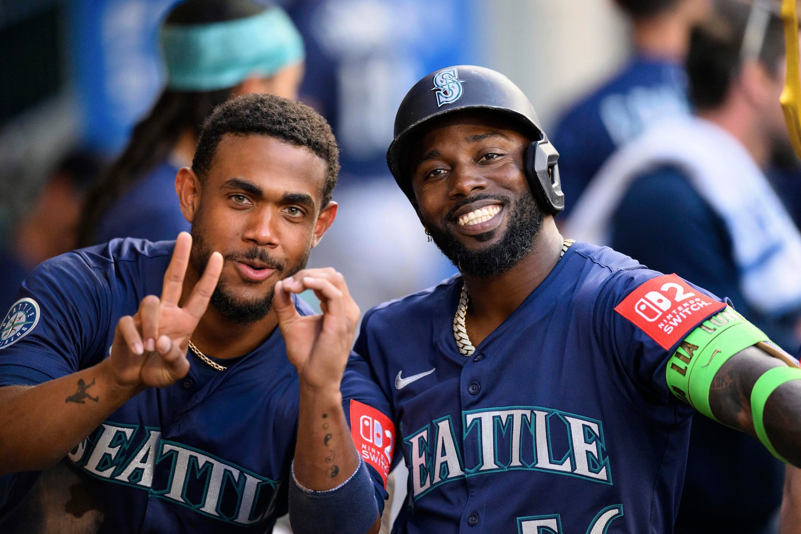 Seattle Mariners Randy Arozarena, right, poses with Seattle Mariners Julio Rodríguez after hitting a home run during the fourth inning of a baseball game against the Los Angeles Angels Saturday, July 26, 2025, in Anaheim, Calif. (AP Photo/William Liang)