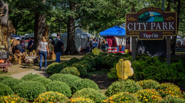 The annual Mum Festival brings crowds and colorful mums to Tipp City and its City Park. TOM GILLIAM / CONTRIBUTING PHOTOGRAPHER