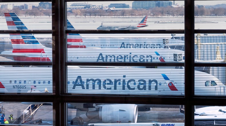 FILE - American Airlines passenger planes are seen at gates at Ronald Reagan Washington National Airport, Jan. 29, 2026 in Arlington, Va. (AP Photo/Cliff Owen, File)