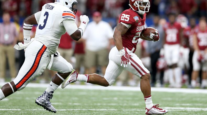 Joe Mixon hasn't even worn a Bengals uniform yet, but there are plenty of fantasy football pundits who believe the rookie from Oklahoma should be the first running back chosen from Cincinnati's roster. Here, he's running away from the Auburn Tigers in the AllState Sugar Bowl.