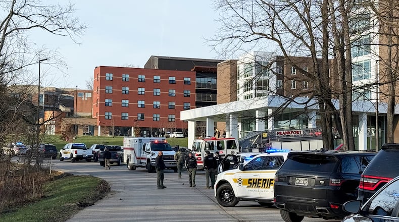 Law enforcement responds to a shooting at Whitney Moore Young Jr. Hall on Kentucky State University's campus in Frankfort, Ky., Tuesday, Dec. 9, 2025. (Hannah Brown/The State Journal via AP)