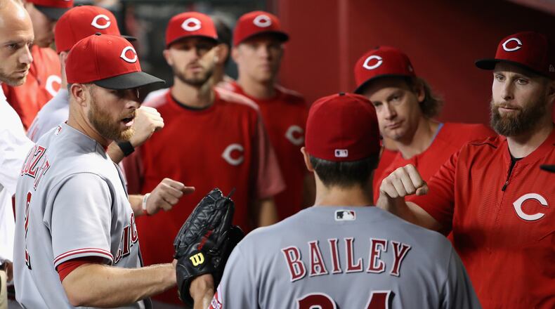 PHOENIX, AZ - JULY 09: Starting pitcher Homer Bailey #34 of the Cincinnati Reds is congratulated by teammates in the dugout after being removed during the seventh inning of the MLB game against the Arizona Diamondbacks at Chase Field on July 9, 2017 in Phoenix, Arizona. (Photo by Christian Petersen/Getty Images)