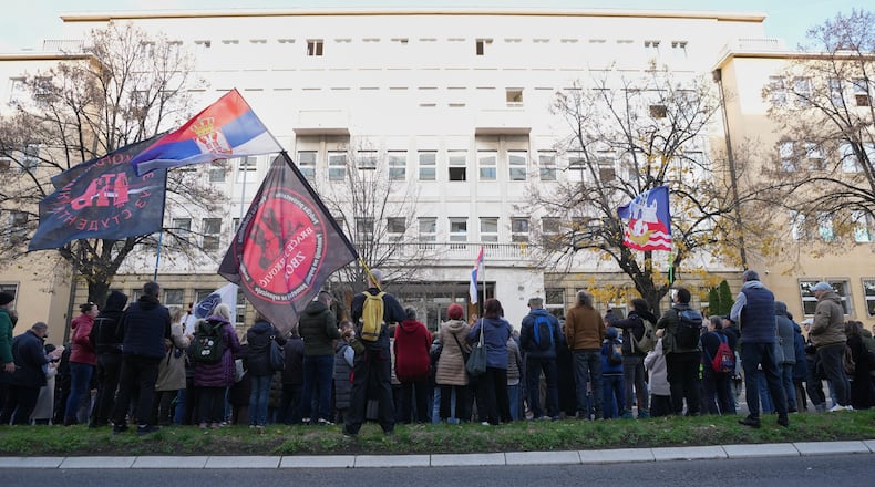 People attend a protest in front of a prosecutor's office for organized crime after Serbian lawmakers last week passed a special law clearing the way for a controversial real estate project that would be financed by an investment company linked to President Trump's son-in-law Jared Kushner, in Belgrade, Serbia, Thursday, Nov. 20, 2025. (AP Photo/Darko Vojinovic)
