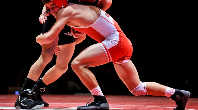 Fairfield’s Zach Shupp (right) competes against Lakota East’s Christian Chavez during a dual match Jan. 14, 2017, at Fairfield High School’s Performing Arts Center. NICK GRAHAM/STAFF