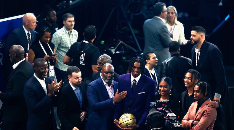 DaRon Holmes II stands with his family and Dayton coach Anthony Grant before the NBA Draft on Wednesday, June 26, 2024, at the Barclays Center in Brooklyn, N.Y. David Jablonski/Staff