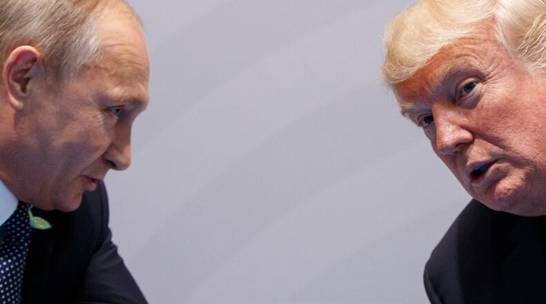 FILE - U.S. President Donald Trump meets with Russian President Vladimir Putin at the G-20 Summit on July 7, 2017, in Hamburg, Germany. (AP Photo/Evan Vucci, File)