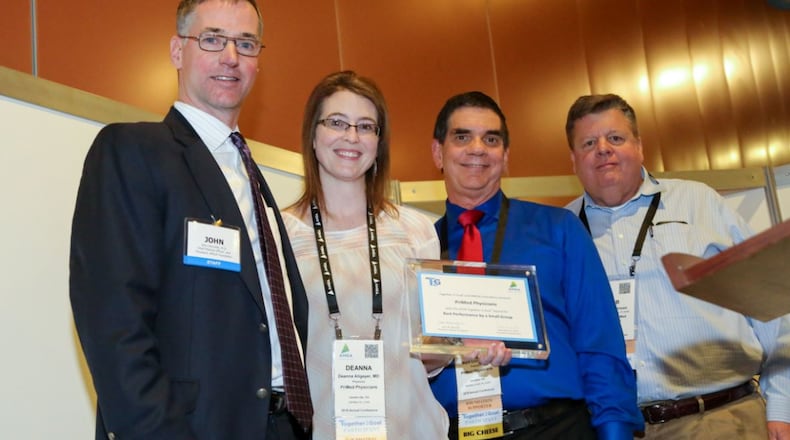 From left, Dr. John Kennedy, president, of American Medical Group Association Foundation, presents an award to PriMed representatives Dr. Deanna Allgeyer, Dr. Mark Couch, and Bob Matthews, president and CEO of MediSync, a partner organization of PriMed. CONTRIBUTED