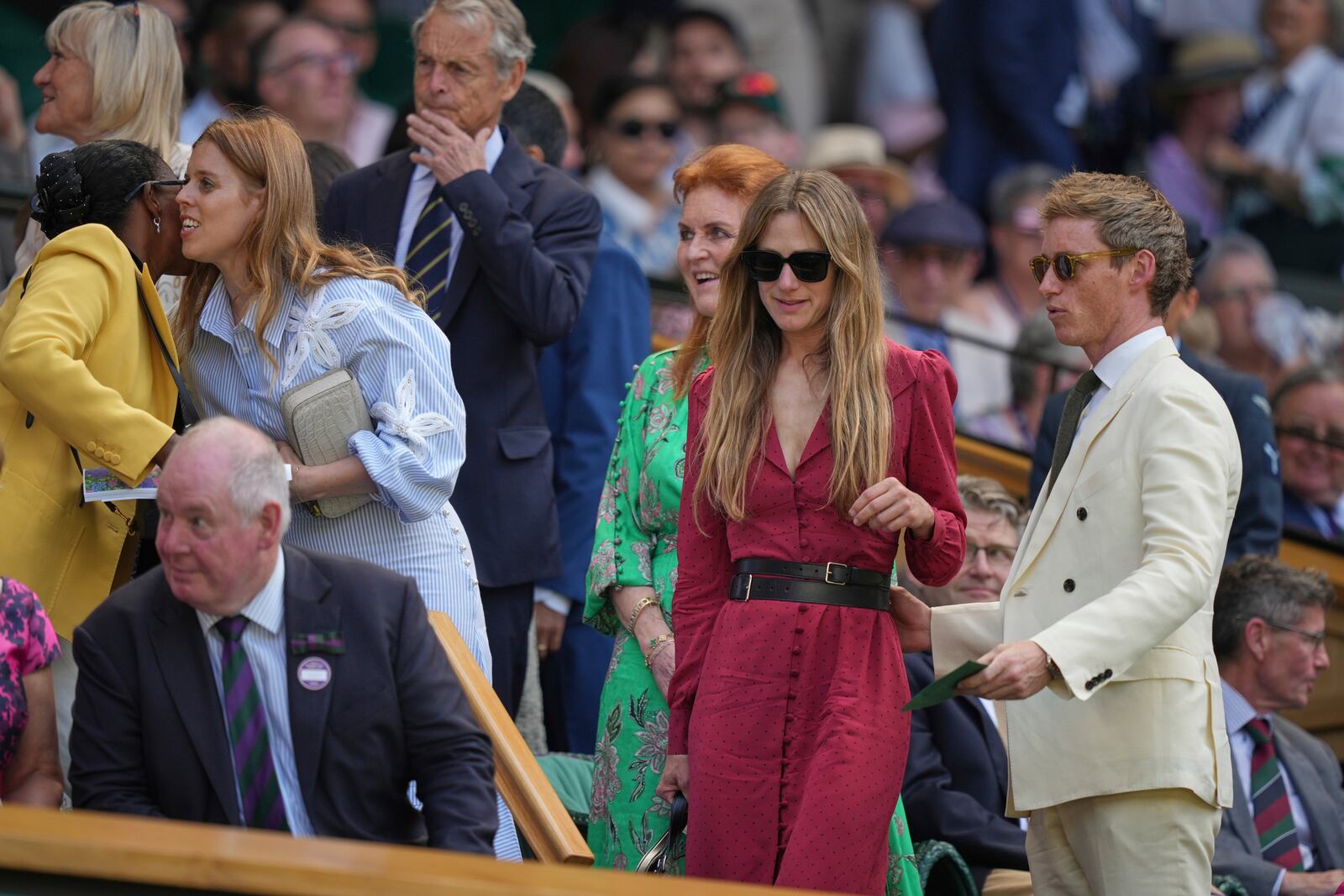Actor Eddie Redmayne, his wife Hannah, Sarah Ferguson, Duchess of York, and Princess Beatrice, from right, take their seats in the Royal Box on Centre Court on day one at the Wimbledon Tennis Championships in London, Monday, June 30, 2025. (AP Photo/Alastair Grant)
