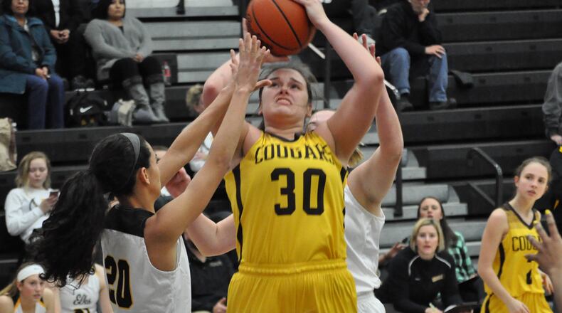 Mikala Morris puts up a shot for Kenton Ridge. NICK DUDUKOVICH / CONTRIBUTOR