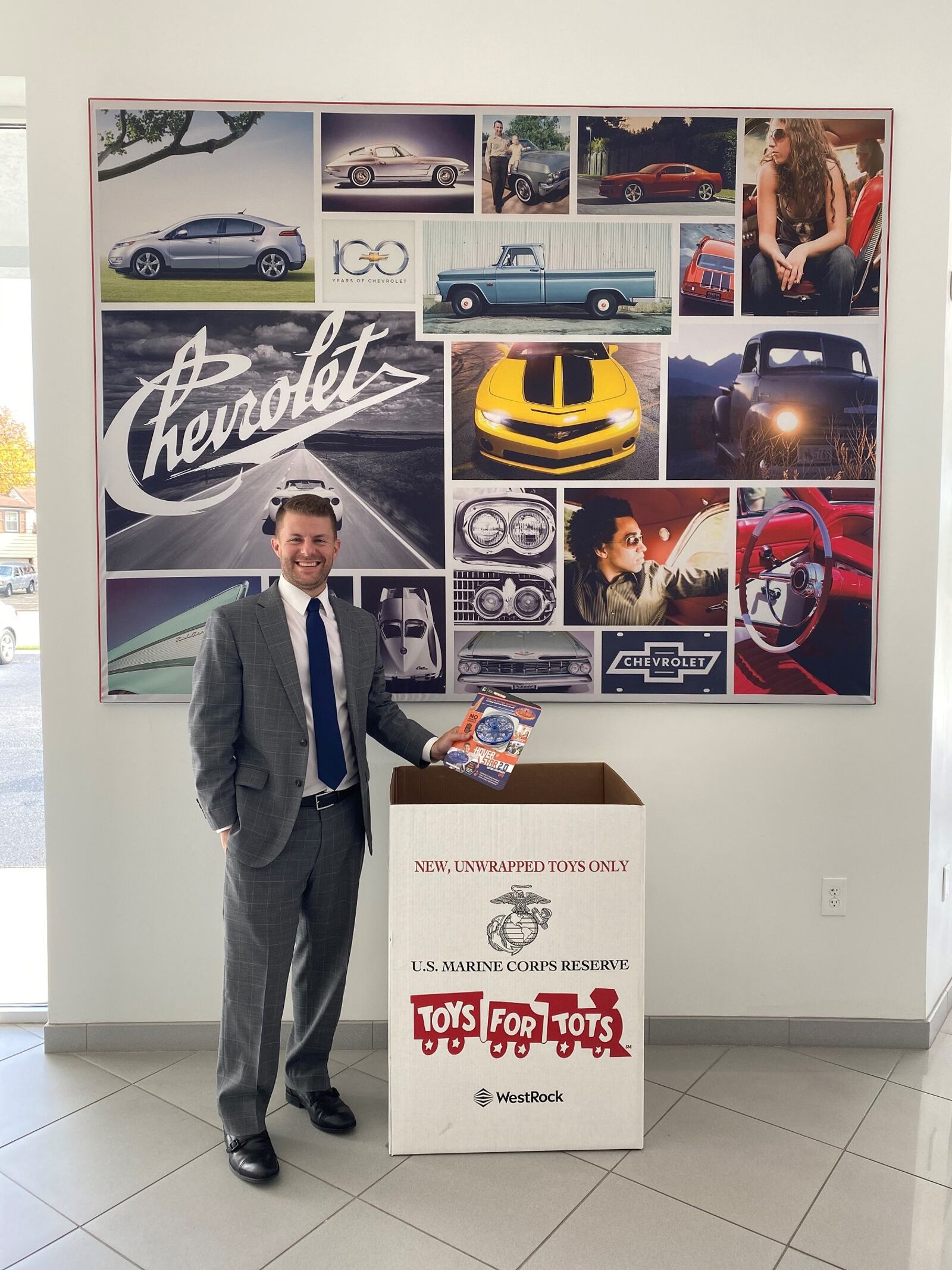 Jeff Schmitt Auto Group has been collecting for Toys for Tots since 2001. Jay Schmitt stands next to a collection box. CONTRIBUTED