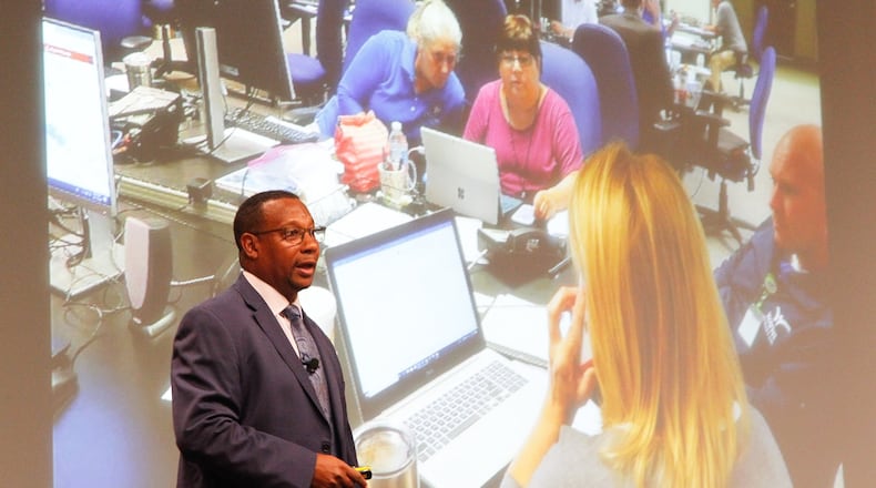 Montgomery County Administrator Michael Colbert discusses emergency management operations during the response to Memorial Day Tornadoes. More than 100 area officials, leaders of social service agencies, nonprofits and faith-based groups, law enforcement and emergency services met Wednesday at Sinclair Community College to learn about the next phase of rebuilding. CHRIS STEWART / STAFF