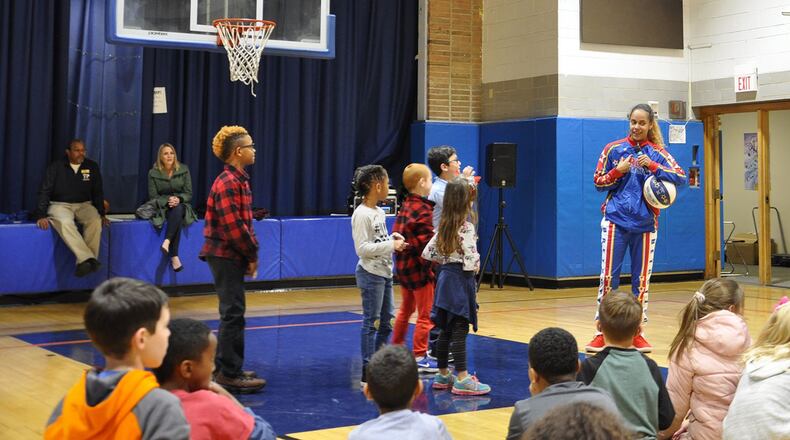 Harlem Globetrotter Briana ‘Hoops’ Green talks to kids about being a team and what to do when they see bullying during a program at the Wright-Patterson Air Force Base Child Development Center Dec. 7. Green’s talk was part of the Globetrotters’ ABCs of Bullying Prevention Program. (U.S. Air Force photo/Loren Deer)