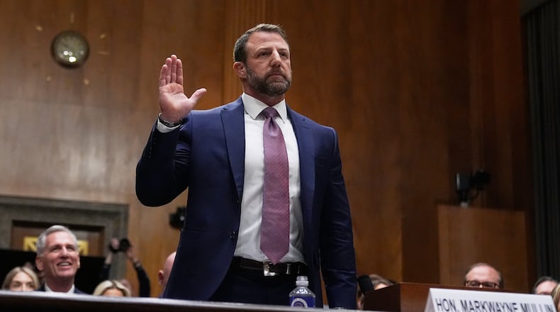Sen. Markwayne Mullin, R-Okla., President Donald Trump's pick for Homeland Security secretary, is sworn in before testifying during Senate Committee on Homeland Security and Governmental Affairs hearing, Wednesday, March 18, 2026 on Capitol Hill in Washington. (AP Photo/Manuel Balce Ceneta)