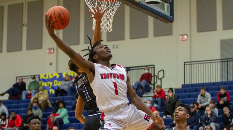 Trotwood sophomore Delamar Blanton scores in the first half Monday against Pace Academy's Kyle Greene at Flyin' To The Hoop. Trotwood lost 80-53, but Blanton scored 23 points, including 19 in the first half. Jeff GIlbert/CONTRIBUTED