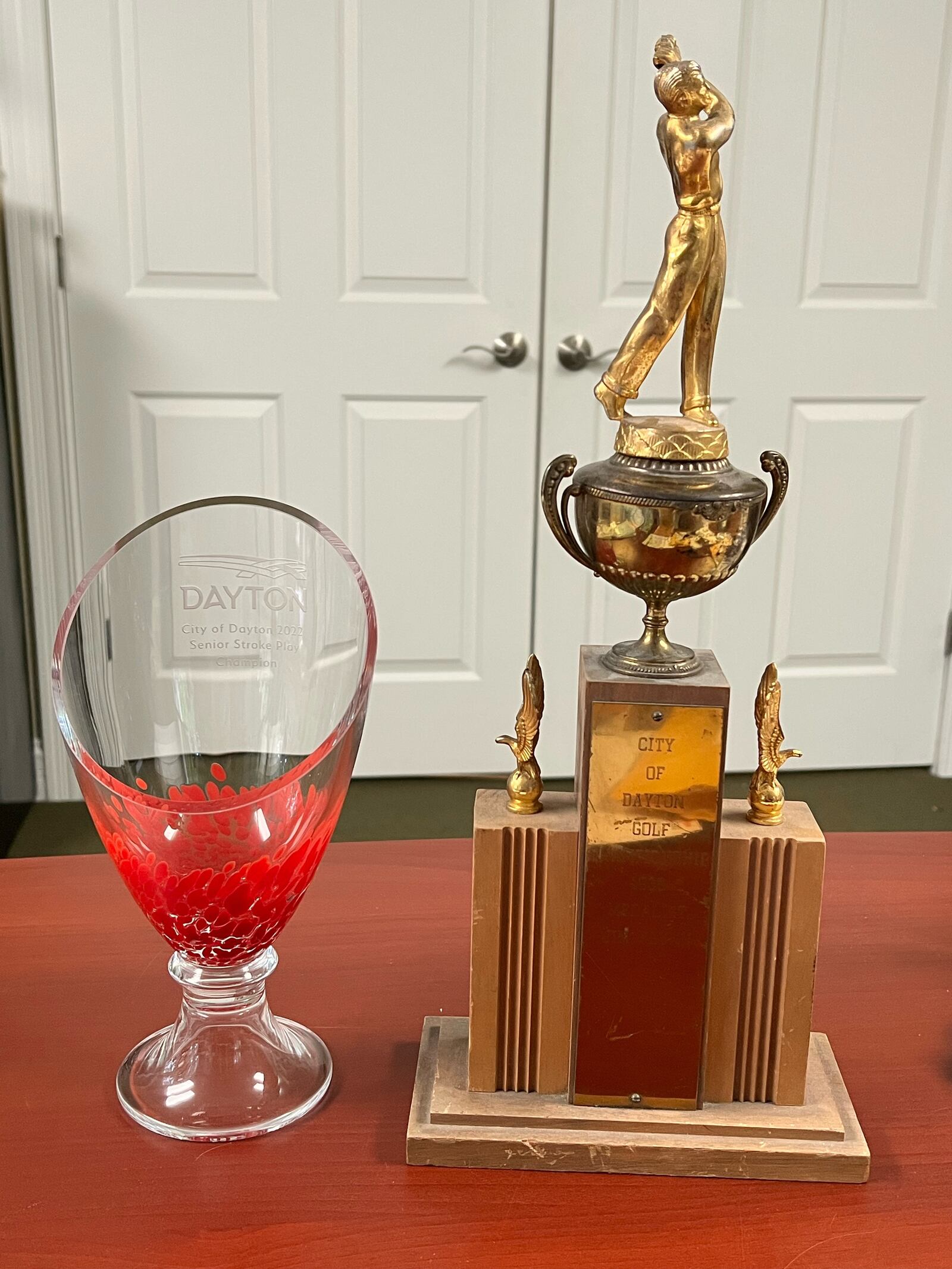 Kevin Flynn's 2022 Dayton Senior Championship trophy, left, is pictured nex to the trophy his grandfather, Jim Flynn, won for winning the 1936 Dayton City Amateur. Contributed photo