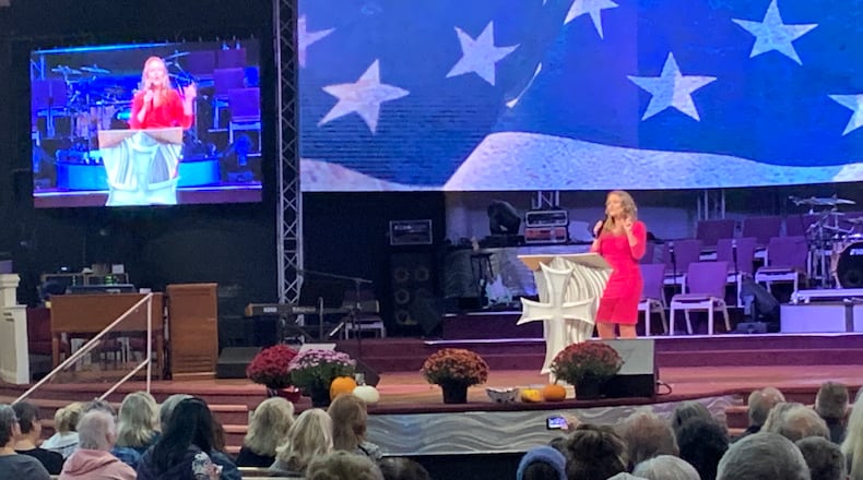 Jenna Ellis, an attorney known for working on former president Donald Trump's legal team, addresses a rally at Solid Rock Church in Lebanon on Oct. 25, 2021.