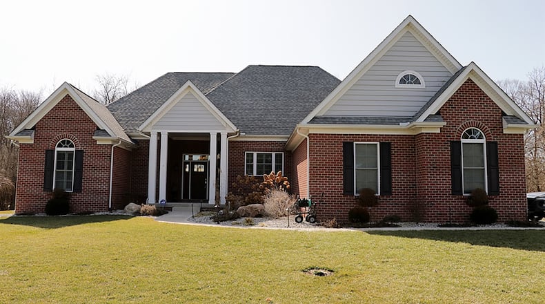 Surrounded by 10 acres with open lawns and wooded walking trails, the custom-built ranch features a split floor plan with 3 bedrooms and has a full, unfinished basement with egress window. CONTRIBUTED PHOTO BY KATHY TYLER