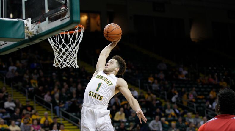 Wright State junior guard Justin Mitchell soars in for a dunk during Friday’s 106-88 win against Detroit. TIM ZECHAR/SUBMITTED PHOTO