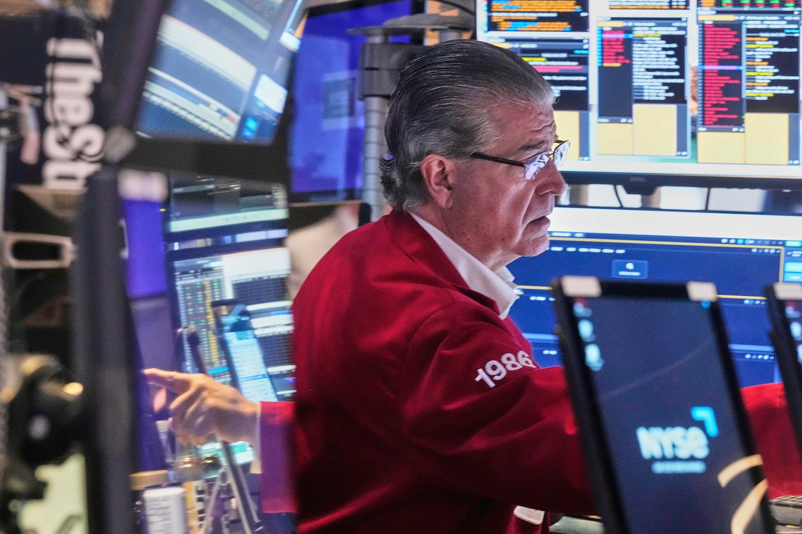 Trader Daniel Kryger works on the floor of the New York Stock Exchange, Tuesday, June 3, 2025. (AP Photo/Richard Drew)