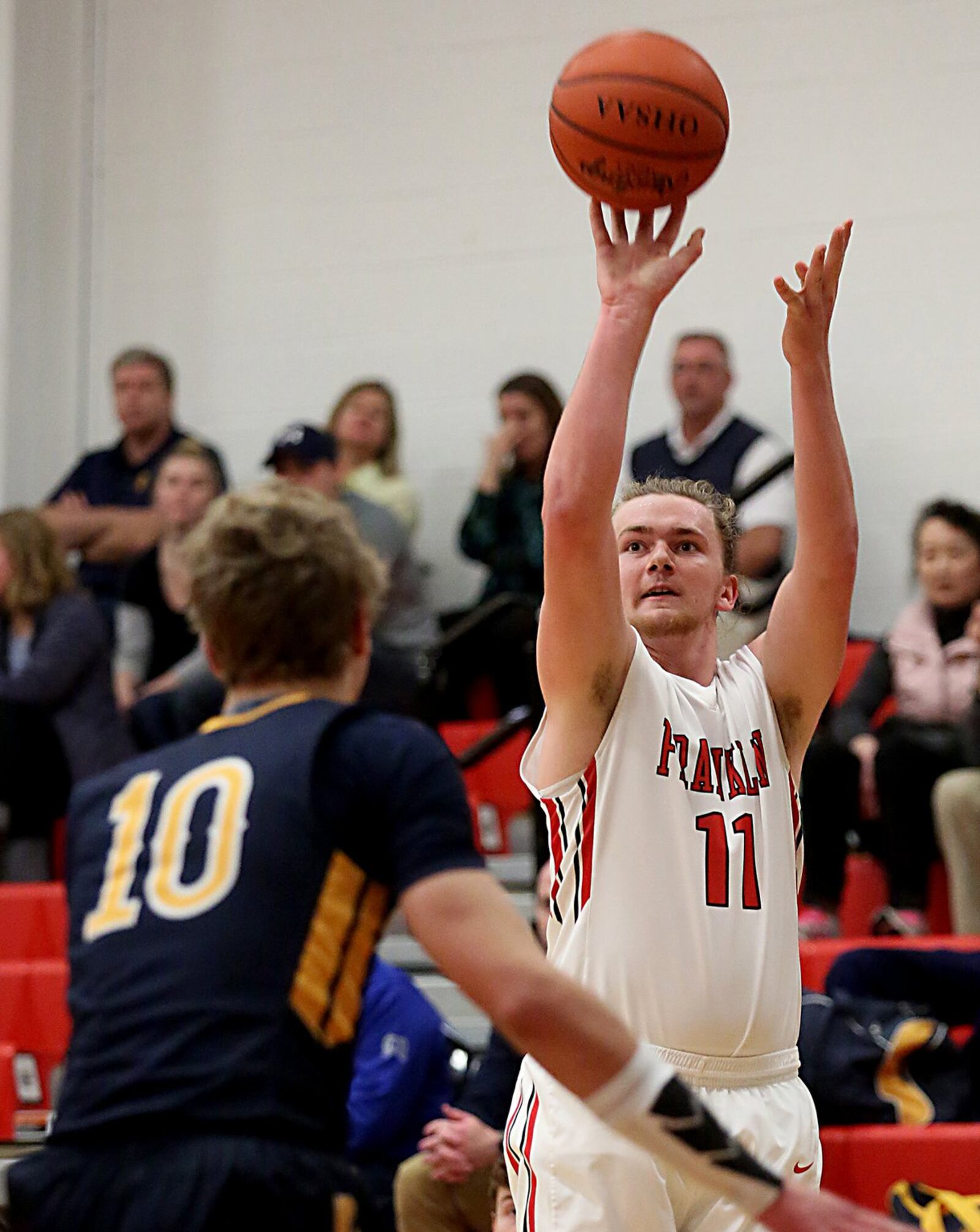 Franklin’s Braden White puts up a shot over Oakwood’s Charlie Haverland during Tuesday night’s game at Darrell Hedric Gymnasium in Franklin. CONTRIBUTED PHOTO BY E.L. HUBBARD