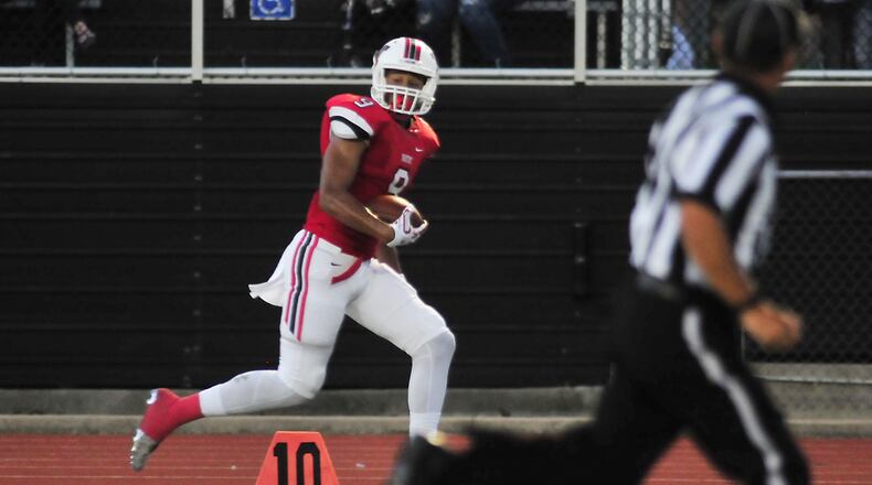 Wayne’s split end junior L’Christian Smith (9) rushes into the goal during a Greater Western Ohio Conference football match up between the Wayne Warriors and the Beavercreek Battling Beavers held Friday evening October 10, 2016 at Wayne High Schools Heidkamp Stadium, final score Wayne 59 Beavercreek 7 10/7/2016 CHARLES CAPERTON/PHOTO CHARLES CAPERTON/PHOTO