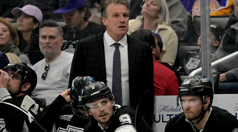 FILE - Los Angeles Kings head coach Jim Hiller stands behind the bench during an NHL hockey game against the Tampa Bay Lightning, Jan. 1, 2026, in Los Angeles. (AP Photo/Jayne Kamin-Oncea, File)