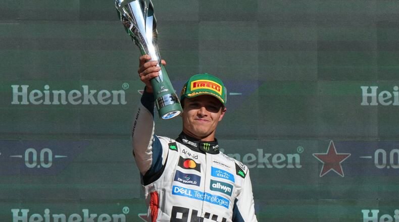 McLaren driver Lando Norris of Britain celebrates after winning the Formula One Mexico Grand Prix in Mexico City, Sunday, Oct. 26, 2025. (AP Photo/Fernando Llano)