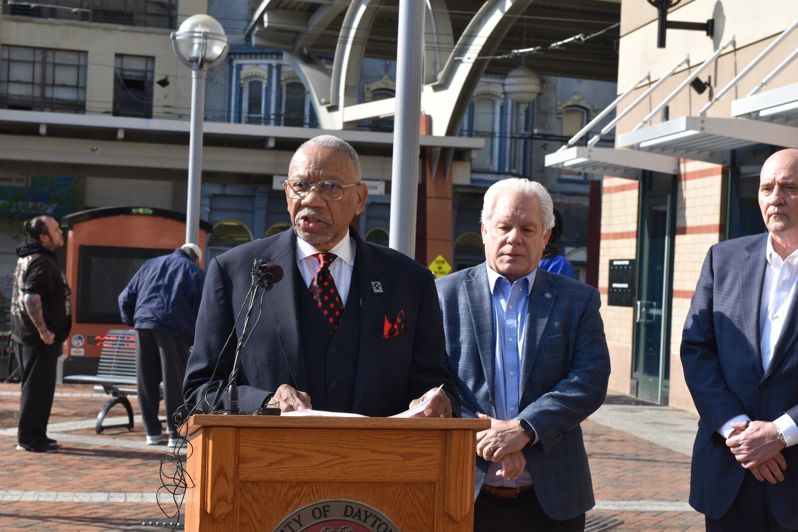 Dayton Mayor Jeffrey Mims Jr. and state Reps. Phil Plummer (R-Dayton) and Tom Young (R-Washington Twp.) spoke on April 10, 2025, about student busing. They say Dayton Public School students need to be taken to and from school on yellow school buses instead of using the public transit system. CORNELIUS FROLIK / STAFF