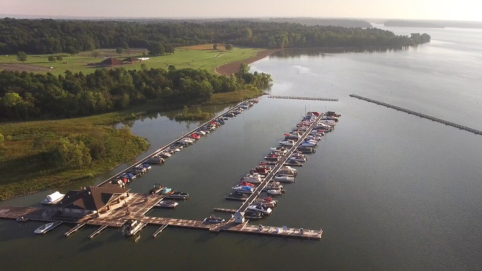 The Caesar Creek Marina which was opened in April of 2016 is almost full of boats as seen in this early morning aerial photo made in August.  Years of planning and $8.8 million have created a busy marina that features more than 100 slips, concessions, fuel and restrooms for boaters.      TY GREENLEES / STAFF