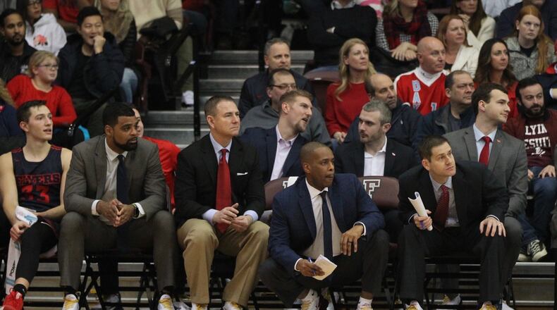Dayton graduate assistant coach Sean Damaska, back center, talks to fellow grad assistant Brett Comer during a game at Fordham on Jan. 26, 2019, at Rose Hill Gym in Bronx, N.Y. David Jablonski/Staff