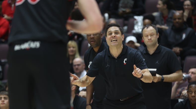 Cincinnati's Wes Miller coaches during a game against Dayton on Saturday, Dec. 16, 2023, at the Heritage Bank Center in Cincinnati. David Jablonski/Staff