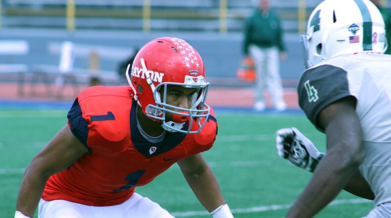 Flyers defensive back Christian Searles battles one-on-one against a Jacksonville receiver in Saturday’s win over Jacksonville. Photo: Mike Hartsock/staff