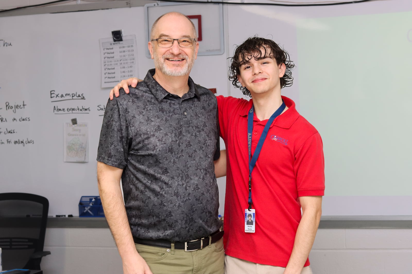 Jim Murray, left, stands with Carroll High School student Nicolas Young. Murray influenced Young to do better in school. Courtesy Archbishop Carroll High School.