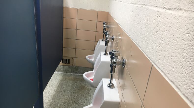 Kettering schools are adding partitions within boys bathrooms that separate the sinks and stalls area from the area with a row of urinals. District officials say the move is to increase student privacy, and it comes on the heels of 2016's national debate over transgender bathroom usage. JEREMY P. KELLEY / STAFF