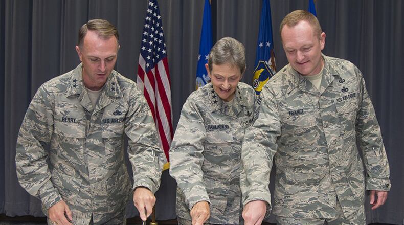 Maj. Gen. Warren D. Berry, Air Force Materiel Command vice commander; Gen. Ellen M. Pawlikowski, AFMC commander; and Chief Master Sgt. Jason L. France, AFMC command chief; cut a cake marking the command’s 25th anniversary during a ceremony in the AFMC Headquarters, Wright-Patterson Air Force Base, Ohio, July 10, 2017. The command was formed in 1992 by the joining of the Air Force Systems Command and the Air Force Logistics Command. (U.S. Air Force photo by R.J. Oriez)