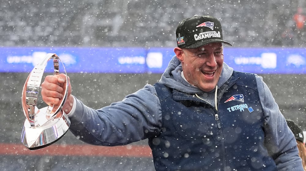 New England Patriots head coach Mike Vrabel celebrates with the trophy after the AFC Championship NFL football game between the Denver Broncos and the New England Patriots, Sunday, Jan. 25, 2026, in Denver. (AP Photo/John Locher)