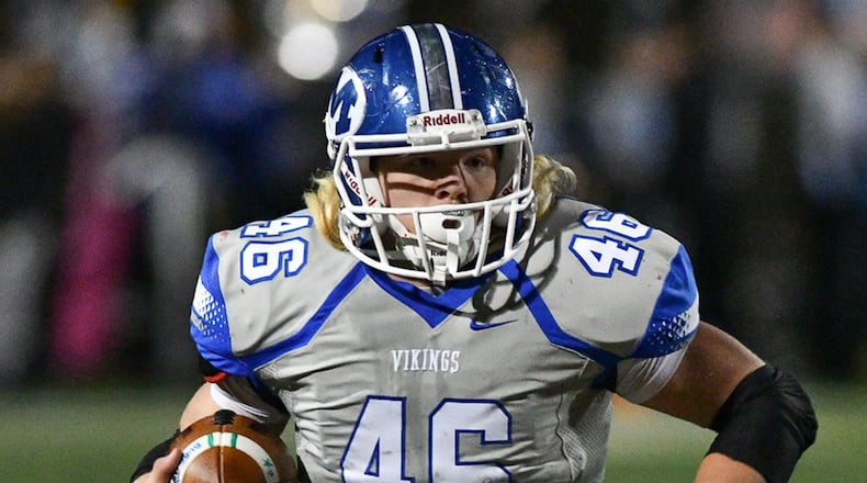 Miamisburg senior fullback Jake Neatherton runs during a Div. II regional semifinal playoff game on Friday, Nov. 11, 2016 at Good Samaritan Stadium in Clayton. Contributed Photo by Bryant Billing