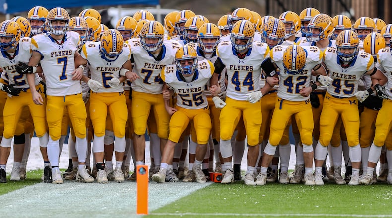Marion Local routed Hillsdale 74-0 on Friday to win its fourth straight Division VII state football championship at Tom Benson Hall of Fame Stadium in Canton. It was the 64th consecutive win for the Flyers. Michael Cooper/CONTRIBUTED