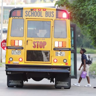 A child walks onto a Dayton Public Schools bus on Dearborn Avenue on Tuesday, Aug. 12, 2025. Private and charter school enrollment in Ohio has soared in the last five years while traditional K-12 enrollment has fallen by nearly 26,895 students, or 1.8%.
BRYANT BILLING / STAFF