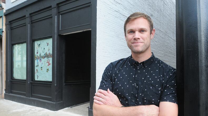 Adam Remillard stands in front of this new storefront in Miamisburg for Monocle Comics & Coffee. This is the building’s first storefront tenant in 25 years. MARSHALL GORBY\STAFF