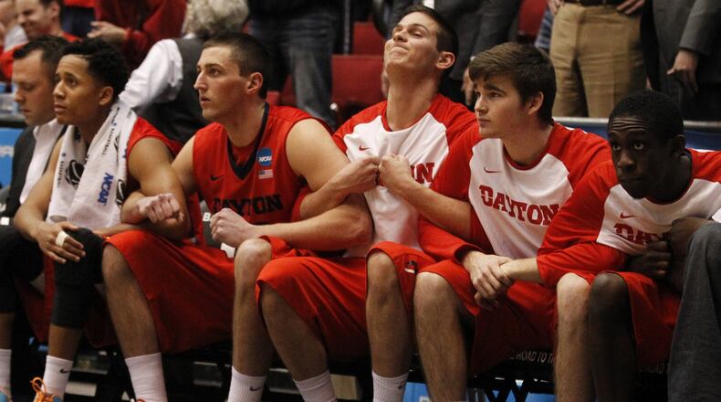 Dayton players watch as Kendall Pollard shoots free throws in the final seconds against Boise State in the First Four on Wednesday, March 18, 2015, at UD Arena. David Jablonski/Staff