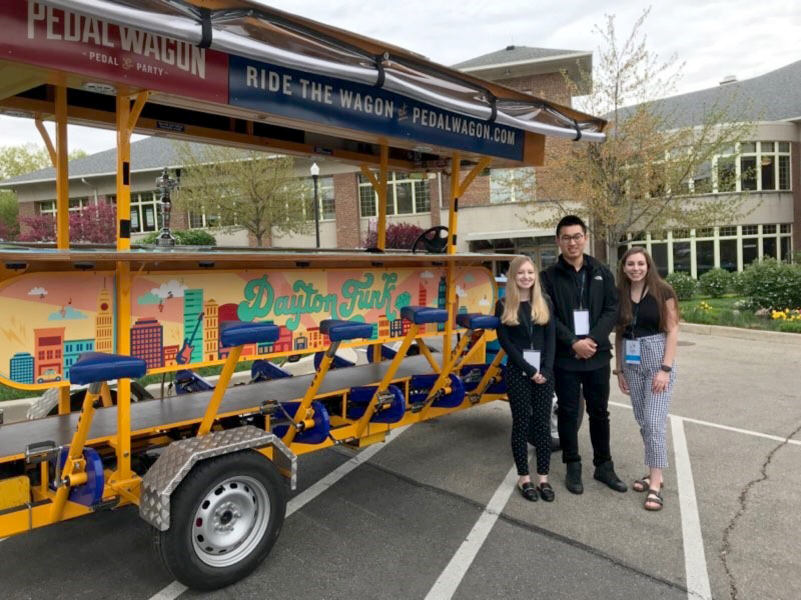 Dayton Pedal Wagon has unveiled its newly wrapped Dayton Funk bike. The wrap was designed as part of University of Dayton graphic design class. The winning design was created by UD students Jess Burnham, Meg Gramza and Nan Xiang, pictured.