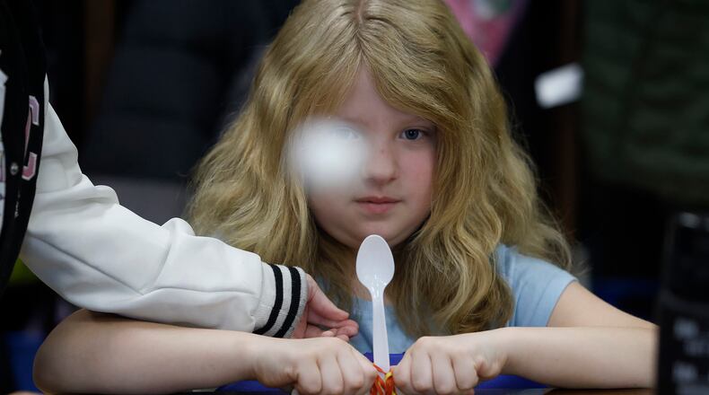 Teralee Herl launches a marshmallow from a catapult her and her partner Freata Williams made  MARSHALL GORBY\STAFF
