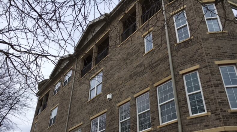 Monument Walk, at Monument and Ludlow downtown, has been seen as a test for whether residents will embrace luxury condos in downtown Dayton. THOMAS GNAU/STAFF