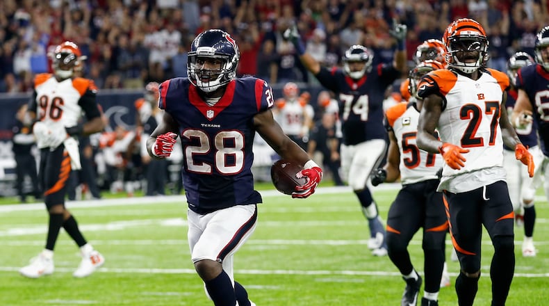 HOUSTON, TX - DECEMBER 24: Alfred Blue #28 of the Houston Texans runs for a 24 yard touchdown in the fourth quarter against the Cincinnati Bengals at NRG Stadium on December 24, 2016 in Houston, Texas. (Photo by Bob Levey/Getty Images)