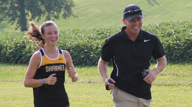 Miah and Brian DeSantis have helped make the Springfield Shawnee girls cross country team a powerhouse program. CONTRIBUTED PHOTO
