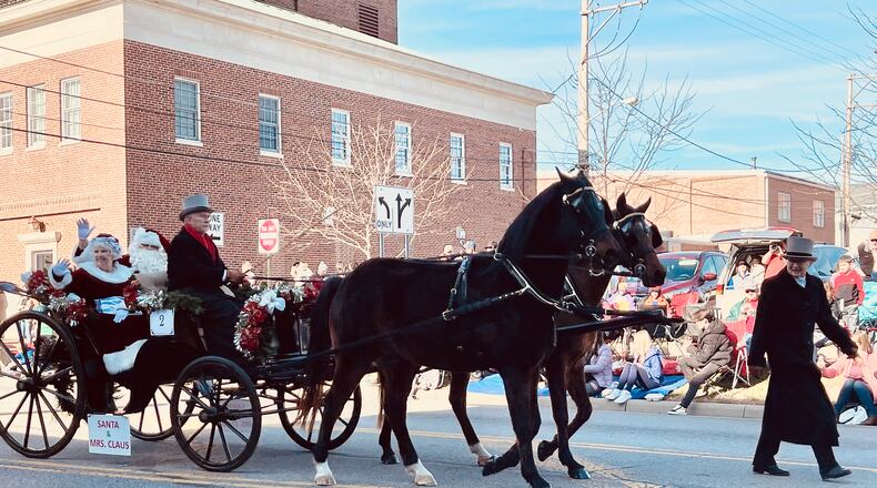 Tens of thousands of people watched the annual horse-drawn carriage parade and festival in downtown Lebanon, Ohio on Sat., Dec. 4, 2021. MANDY GAMBRELL/FILE PHOTO